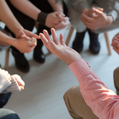 Close-up of therapist’s hands explaining a problem to his patients Close-up of therapist's hands explaining a problem to his patients